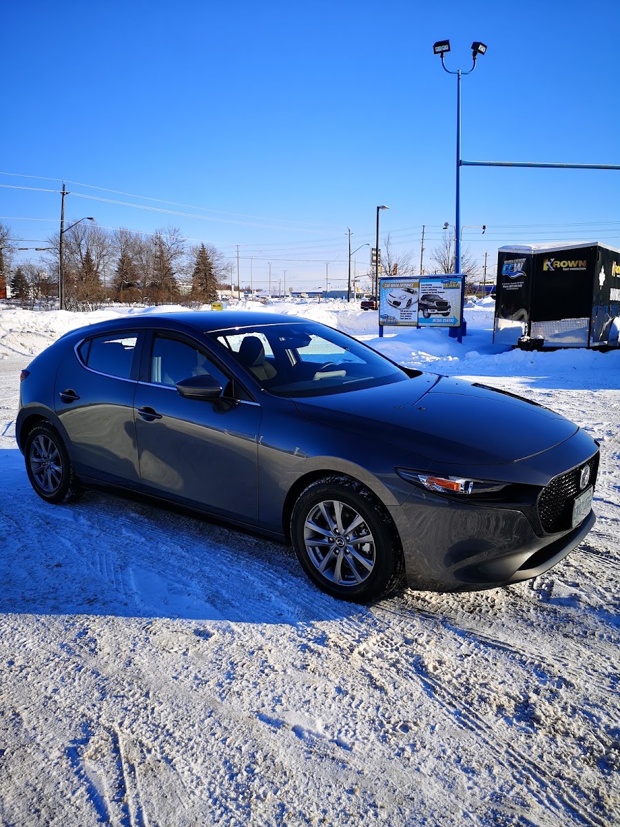 Freshly washed Mazda at Central Car Wash — Car Wash Entrance, Detail Centre, and Krown trailer visible.