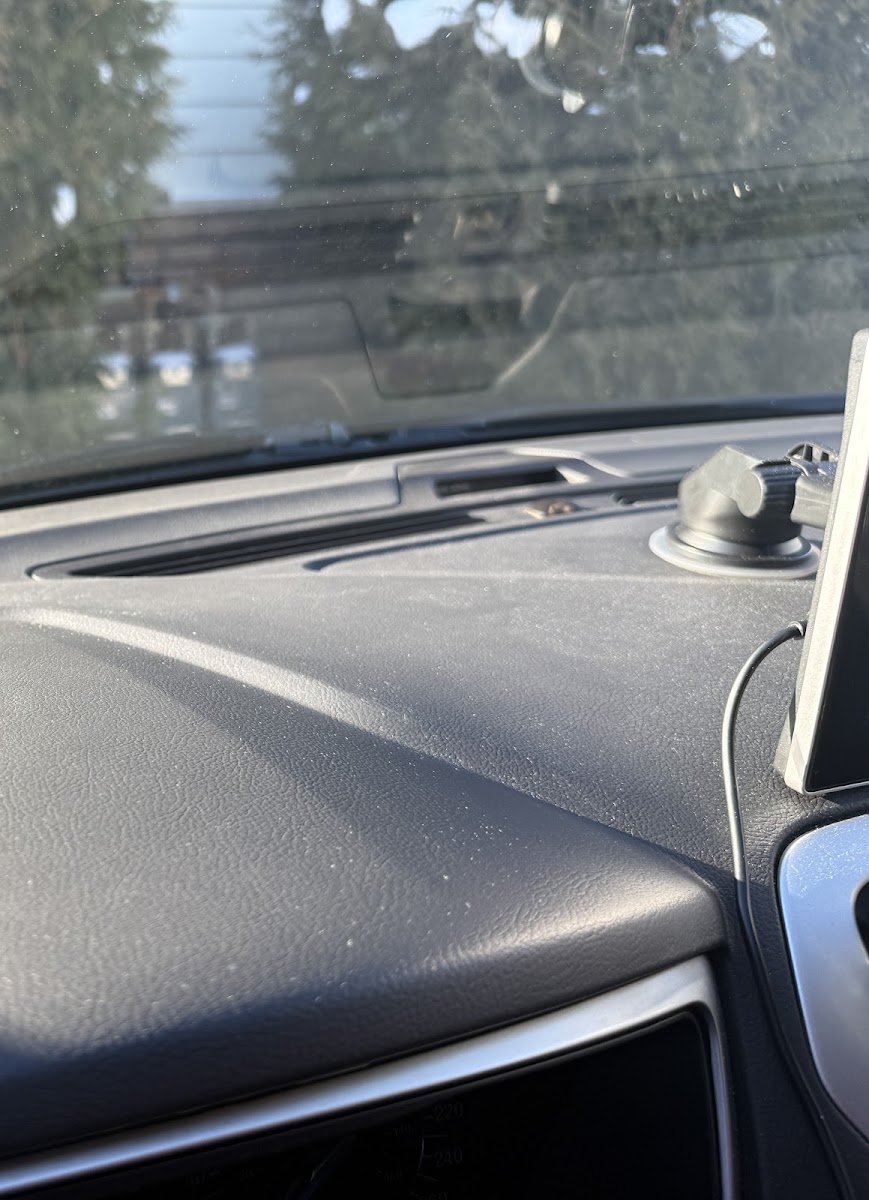 Dusty dash surface before interior wipe and detail.